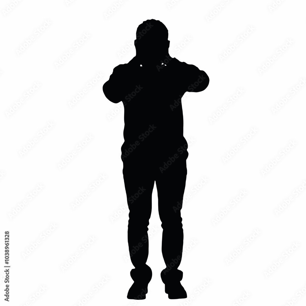 A silhouette of a person standing with their hands covering their face