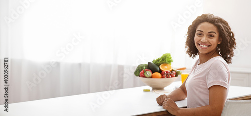 Woman dietologist with medical chart and african young lady smiling at camera, panorama with copy space photo