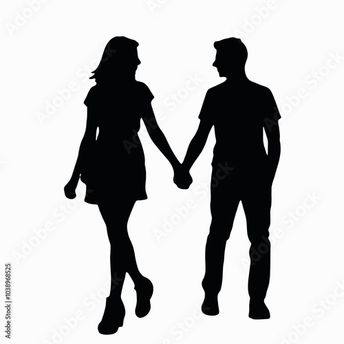 A young Caucasian couple holding hands while walking together silhouette