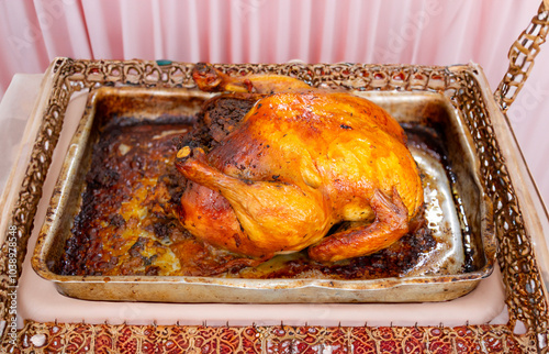 Rustic roast chicken stuffed with farofa photo