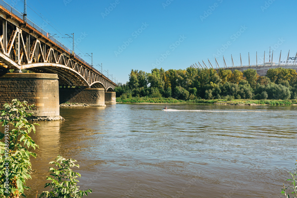 Fototapeta premium Bridge over the Vistula river in Warsaw, Poland, in a bright sunny day