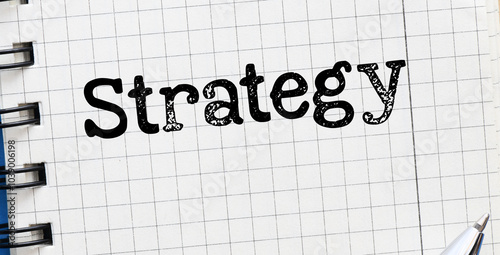 STRATEGY word in an office notebook.