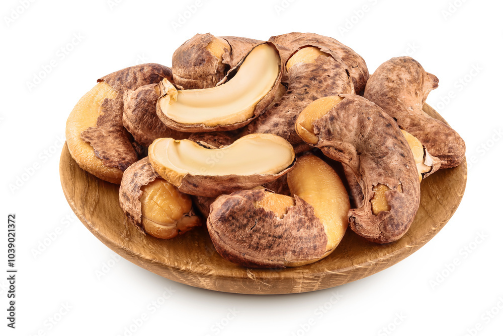 cashew nut with shell in wooden bowl isolated on white background cashew nut with shell in wooden bowl isolated on white background
