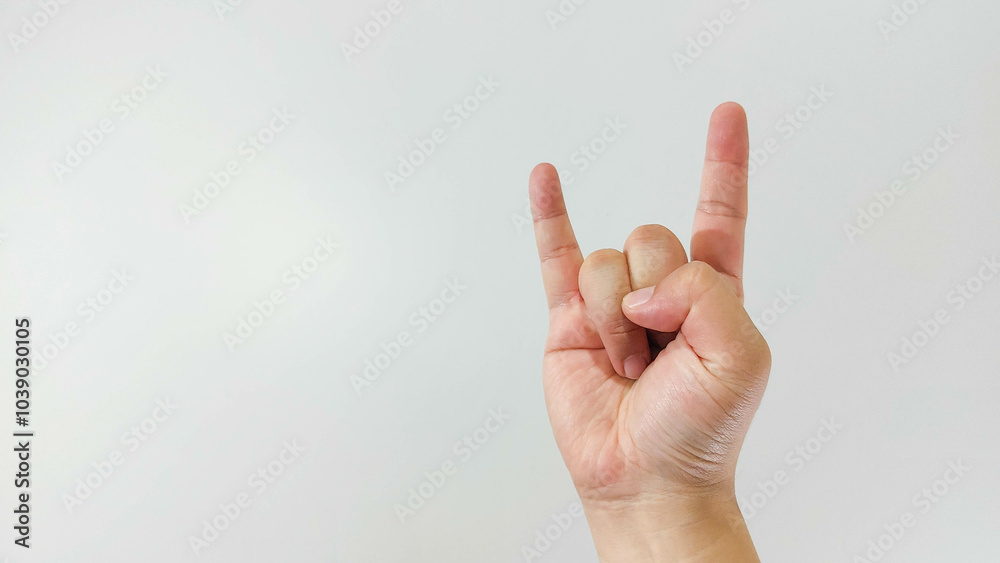Hand gesture close up, rock and roll sign. Isolated on white background Hand gesture close up, rock and roll sign. Isolated on white background