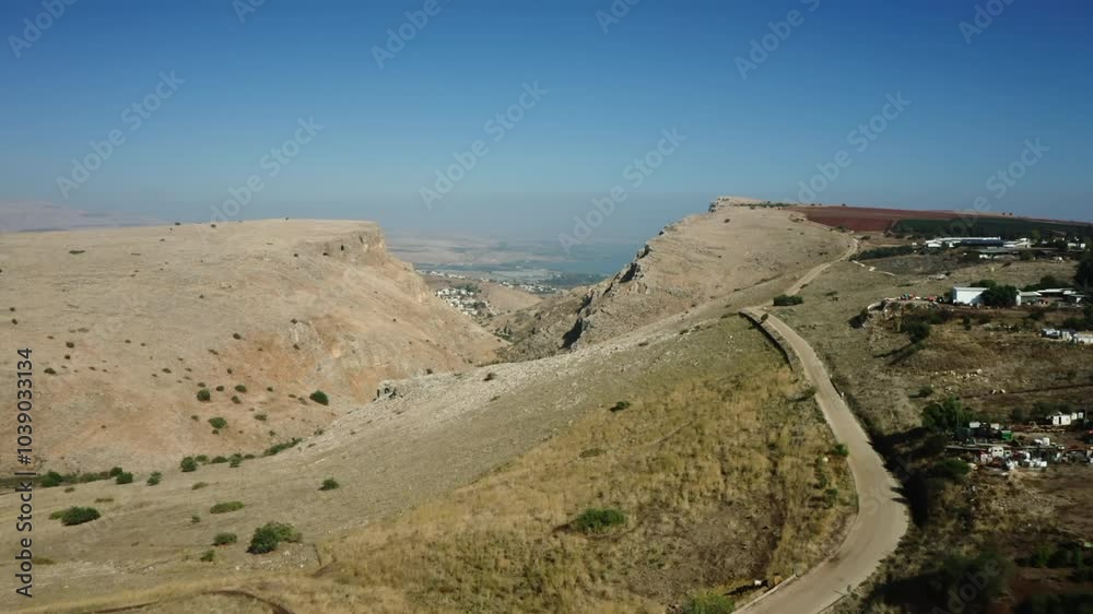 Arbel cliff with the Sea of Galilee in the background, Lower Galilee, Israel Arbel cliff with the Sea of Galilee in the background, Lower Galilee, Israel