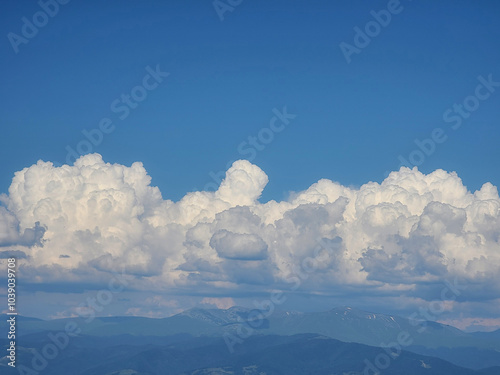 Cumulus Clouds Over Mountain Landscape