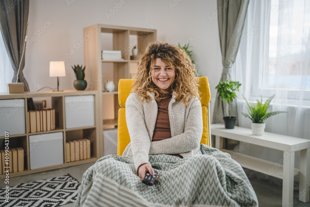 One woman sit at home with remote controller watch TV happy smile One woman sit at home with remote controller watch TV happy smile