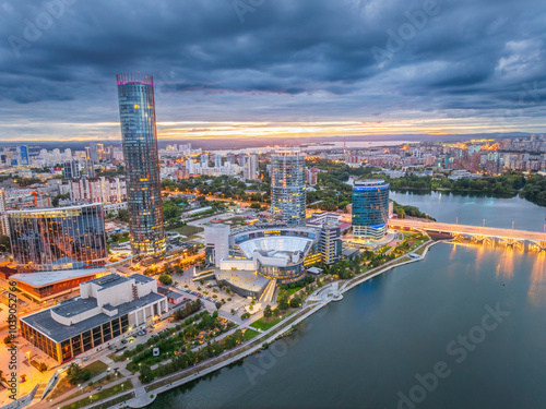 Yekaterinburg city and pond aerial panoramic view at summer or early autumn sunset. Night city in the early autumn or summer.