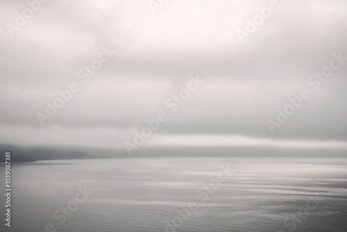 A Foggy Coastal Landscape with a Calm Sea