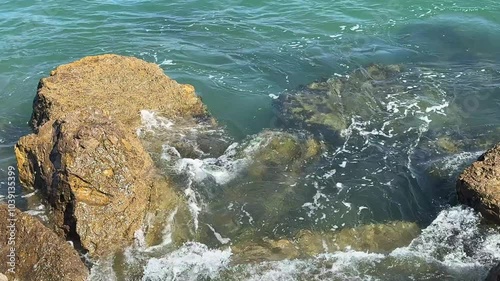 Ocean water flowing over coastal rocks