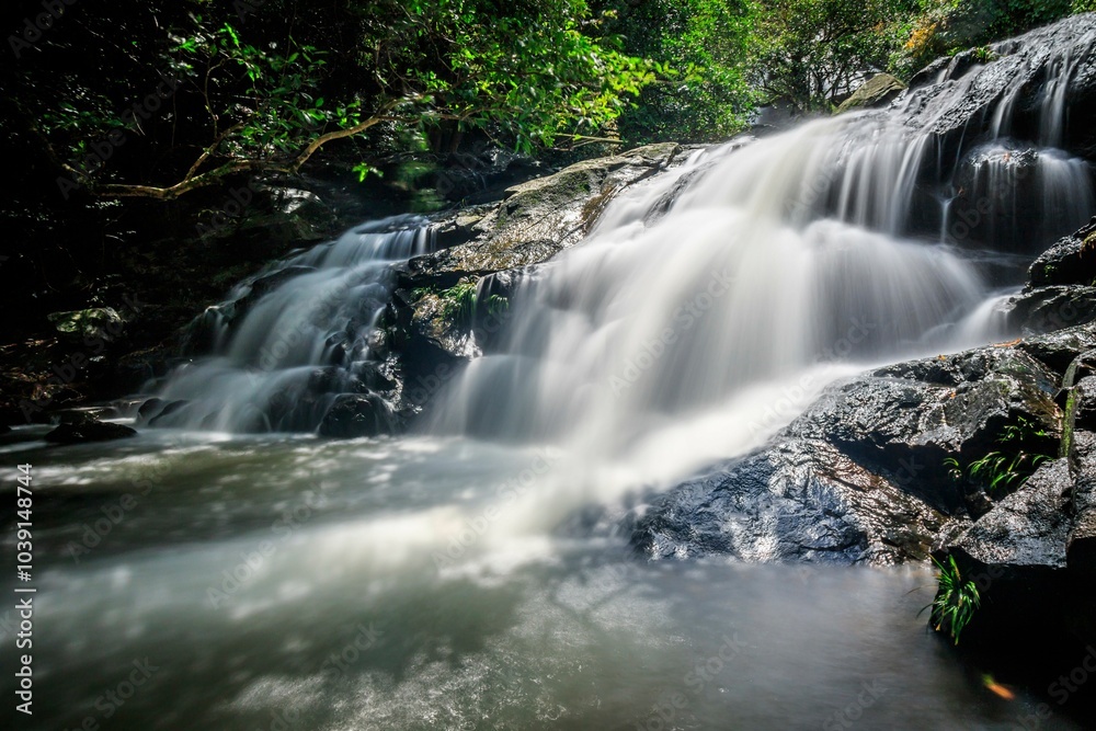 Serene Waterfall Cascading Over Smooth Rocks in Nature, Little Hawaii Falls, Hong Kong Serene Waterfall Cascading Over Smooth Rocks in Nature, Little Hawaii Falls, Hong Kong