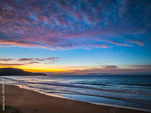 Winter seascape views over the beach with high and medium cloud cover