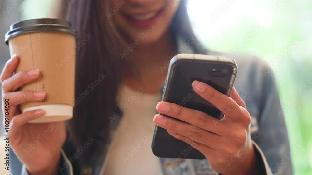 Young asian beautiful woman using smart phone in coffee shop cafe, typing write message on mobile, online shopping, transfer payment, internet banking