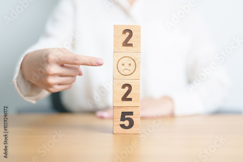 Happy New Year 2025 with Sad face block. Satisfaction, feedback, Review, mental health, eco sustainable and bad year concept