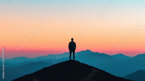 Silhouetted figure standing alone on a hilltop gazing out at a breathtaking mountainous landscape bathed in the warm glow of a sunrise or sunset