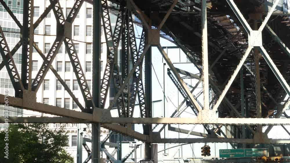 New York elevated subway, metropolitan bridge, metro track above street. Railway transport over road. Old railroad line. Queens Plaza public transportation. Queensboro, Long Island city, United States New York elevated subway, metropolitan bridge, metro track above street. Railway transport over road. Old railroad line. Queens Plaza public transportation. Queensboro, Long Island city, United States