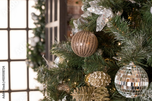 The interior of a room decorated for the holiday. Christmas New Year tree with garlands.Christmas tree branches with decorations, balls, garlands