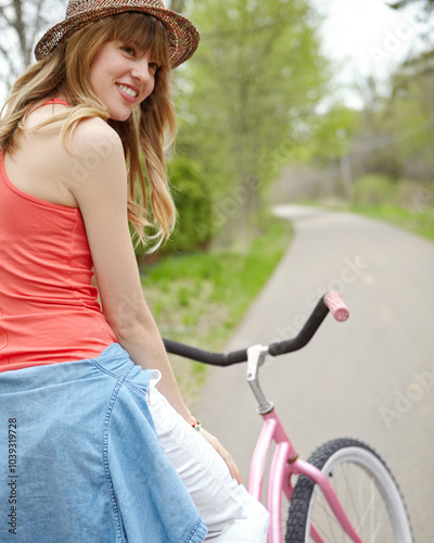 Outdoor, smile and woman with bicycle, travel and eco friendly with reduced emissions and weekend. Commuting, happy and person with transport, ride and cycling in morning, energy and active with bike photo