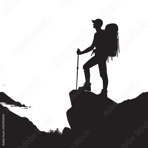 Silhouette of hiker standing on cliff edge.