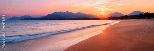 The beach under the sunset, golden sand and calm sea water photo