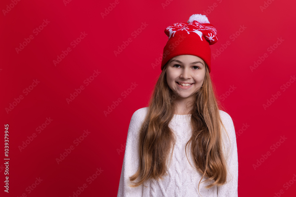 Girl with winter hat isolated on red. Winter Christmas fashion style trend. Teen girl in hat enjoying childhood. Girl wearing trendy outfit with knitted Christmas hat. Copy space Girl with winter hat isolated on red. Winter Christmas fashion style trend. Teen girl in hat enjoying childhood. Girl wearing trendy outfit with knitted Christmas hat. Copy space