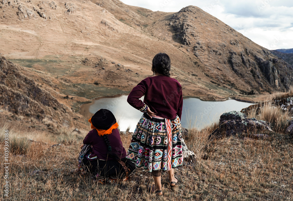 Ταπετσαρία Two Quechua women in traditional clothing looking at a lake in the Andes Mountai
