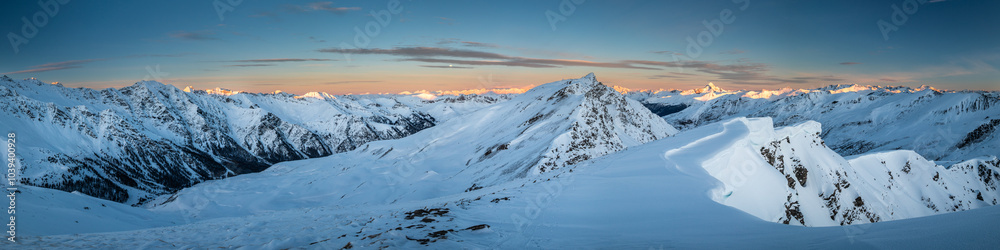 Panoramic view of mountain range at sunrise; mountains covered by snow in Queyras Panoramic view of mountain range at sunrise; mountains covered by snow in Queyras