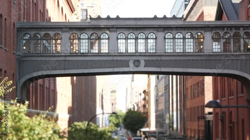 New York City street, Chelsea Market skybridge. Retro industrial architecture, red brick building. American old historic elevated sky bridge Manhattan landmark, USA. Meatpacking district, High Line.