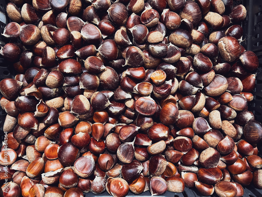 Chestnuts. Background of sweet raw chestnuts for sale at local market Chestnuts. Background of sweet raw chestnuts for sale at local market