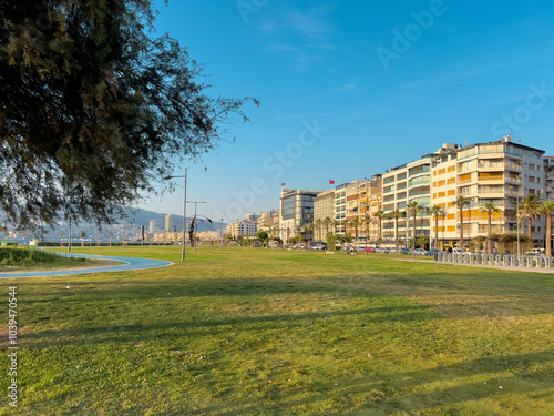 View of Kordon Street, ferry pier and high-rise buildings from the sea in Izmir Passport area photo