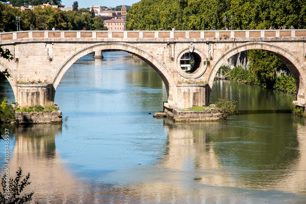 Old bridge over the Tiber River with water reflection in Rome, Italy Old bridge over the Tiber River with water reflection in Rome, Italy