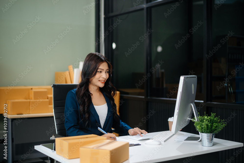 Businesswoman handling packaging and logistics in a modern workspace, managing e-commerce orders efficiently Businesswoman handling packaging and logistics in a modern workspace, managing e-commerce orders efficiently