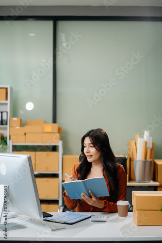 Businesswoman handling packaging and logistics in a modern workspace, managing e-commerce orders efficiently