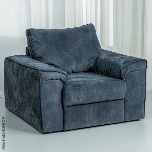 A cozy, modern armchair with plush fabric, ideal for relaxation and comfort in living spaces.