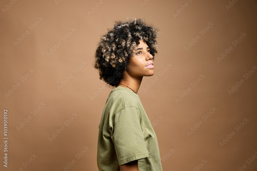 Smiling woman with vitiligo against beige background Smiling woman with vitiligo against beige background