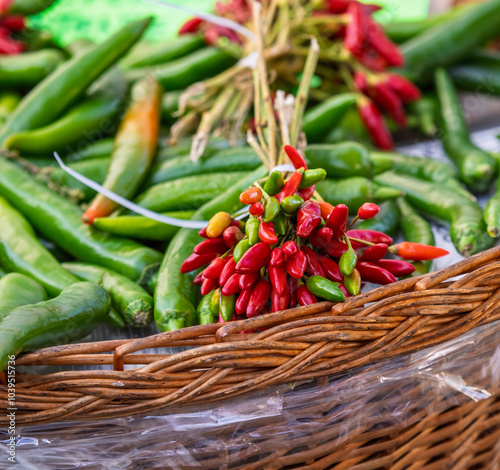 Pile of red spicy chili peppers at fresh market photo