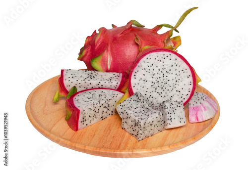 isolated dragon fruit on wooden plate