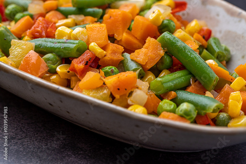 Mexican Mix of Vegetables. Tomatoes, Green Beans, Peas, Corn. Dietary Food.Bright vegetable mix .Vegetarian food.Assorted.