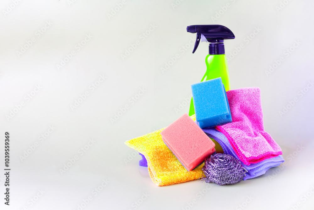 A set of items for cleaning and maintaining cleanliness in the house on a light background of copy space A set of items for cleaning and maintaining cleanliness in the house on a light background of copy space