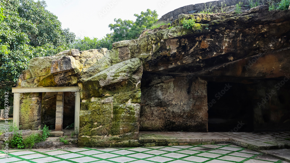 Ruined rock-cut view of the 4th-century Khambhalida Buddhist Cave, Rajkot, Gujarat, India. Ruined rock-cut view of the 4th-century Khambhalida Buddhist Cave, Rajkot, Gujarat, India.