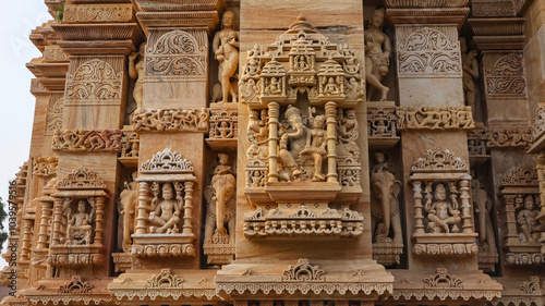 Carved sculptures of Hindu deities on Shri Trinetreshwar Mahadev Temple, Taranetar, Surendranagar, Gujarat, India. photo