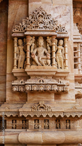 Carved sculpture of Lord Indra sitting on the elephant, his vahana, at Shri Trinetreshwar Mahadev Temple, Taranetar, Surendranagar, Gujarat, India. photo