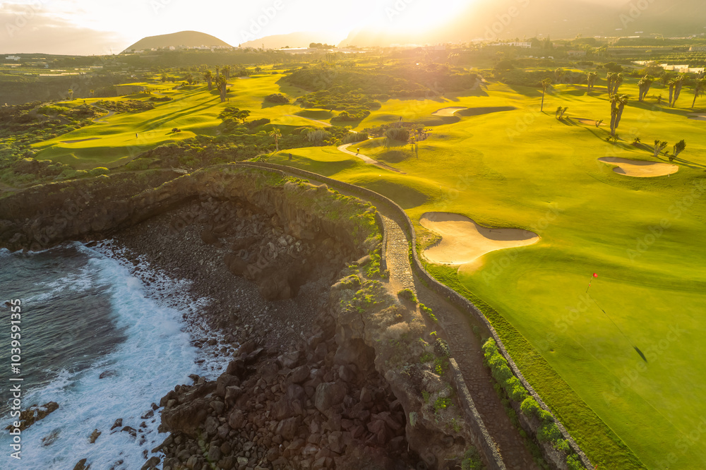 Aerial view of a golf club field at sunset on Tenerife Island, Spain.