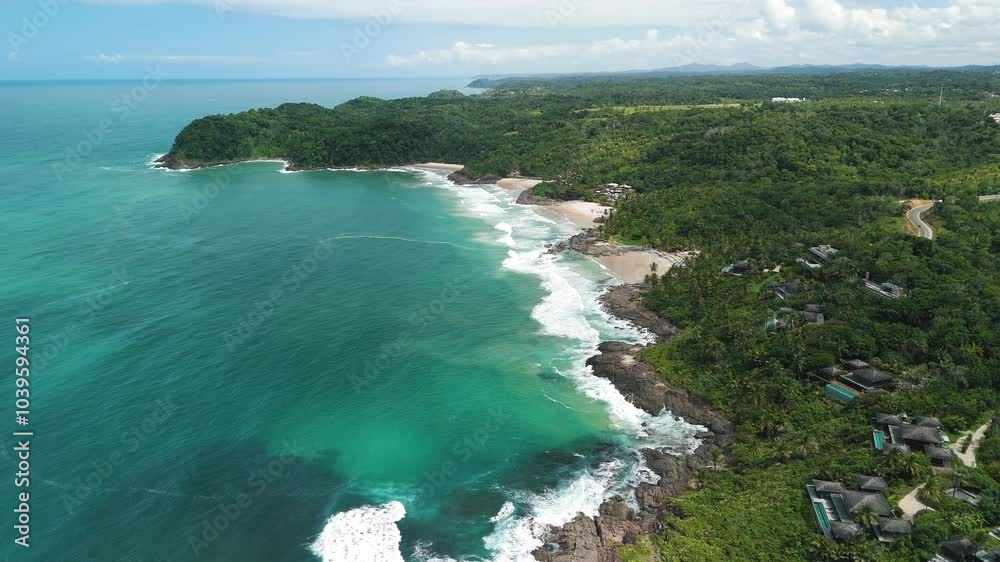 Drone ascends over four white sandy beaches, lush jungle, rocky coast, and blue ocean in Itacare, Bahia Drone ascends over four white sandy beaches, lush jungle, rocky coast, and blue ocean in Itacare, Bahia