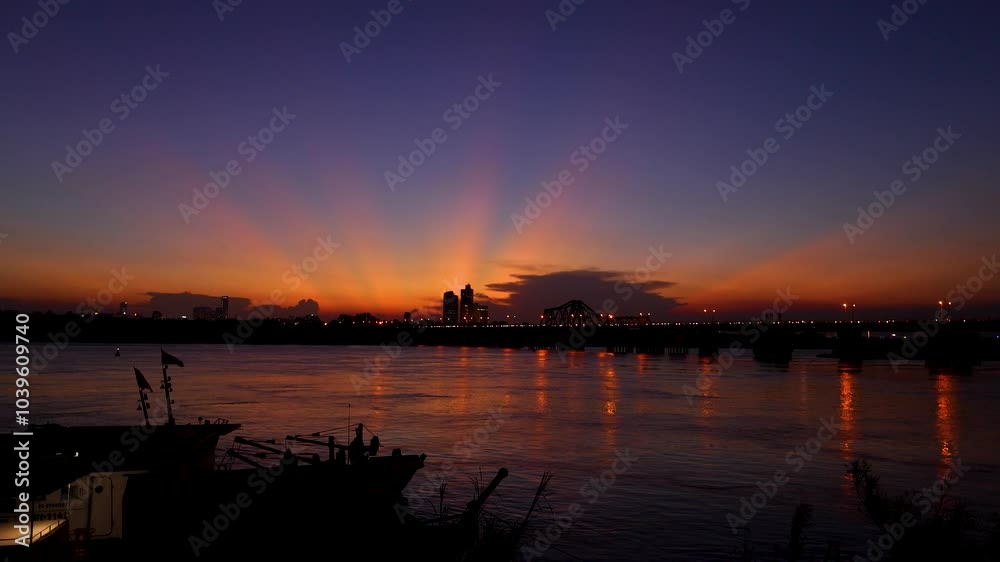 Beautiful sunset view of Long Bien bridge over Hong river (or Red river) that connects two districts, Hoan Kiem and Long Bien in Hanoi city, Vietnam. Beautiful sunset view of Long Bien bridge over Hong river (or Red river) that connects two districts, Hoan Kiem and Long Bien in Hanoi city, Vietnam.