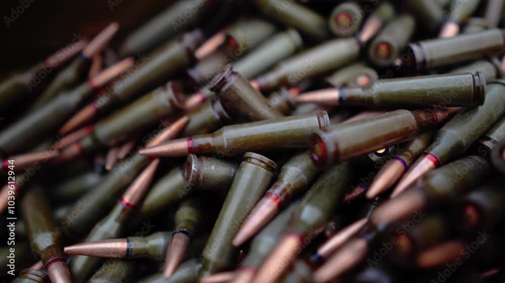 A box of machine gun cartridges close-up. There are many cartridges for automatic weapons on the table A box of machine gun cartridges close-up. There are many cartridges for automatic weapons on the table