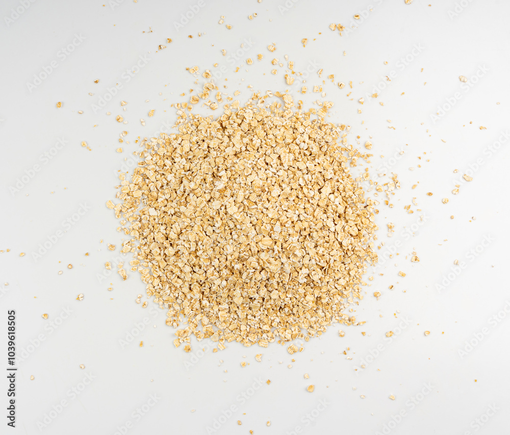 Dry raw oat flakes isolated, rolled flat grains, instant porridge, thin cereals, flattened grains group Dry raw oat flakes isolated, rolled flat grains, instant porridge, thin cereals, flattened grains group