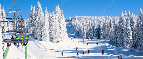 Obraz na płótnie Ski resort lift, slope, people skiing