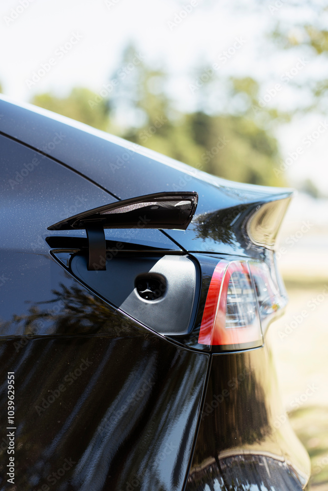 Fototapeta premium Charging port open and ready on modern electric car