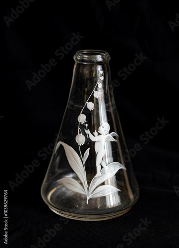 Antique glass vase with handpainted pattern: a little angel with bellflower